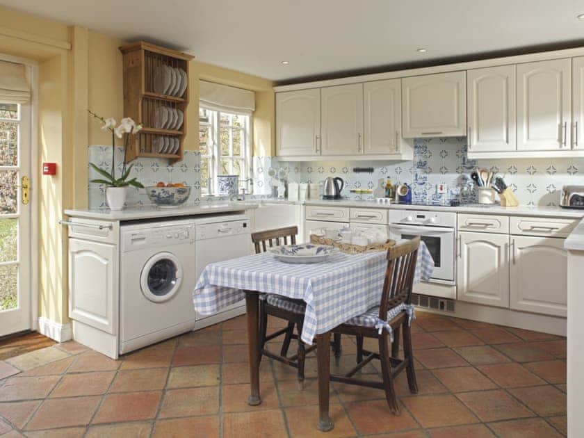 Well-appointed fitted kitchen with dining area | Saratoga - Bruern Holiday Cottages, Bruern, near Chipping Norton