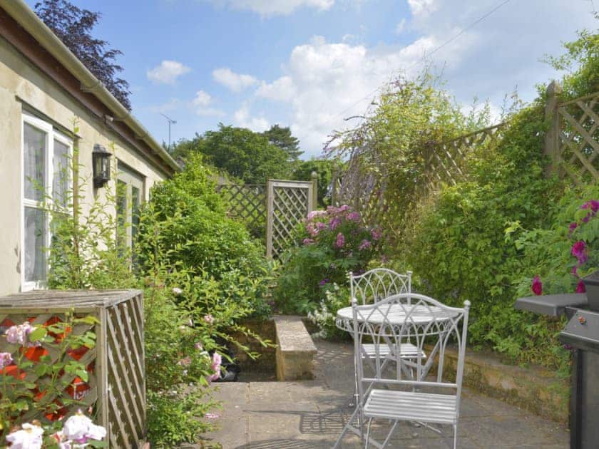 Enclosed patio with outdoor furniture | Cope - Bruern Holiday Cottages, Bruern, near Chipping Norton
