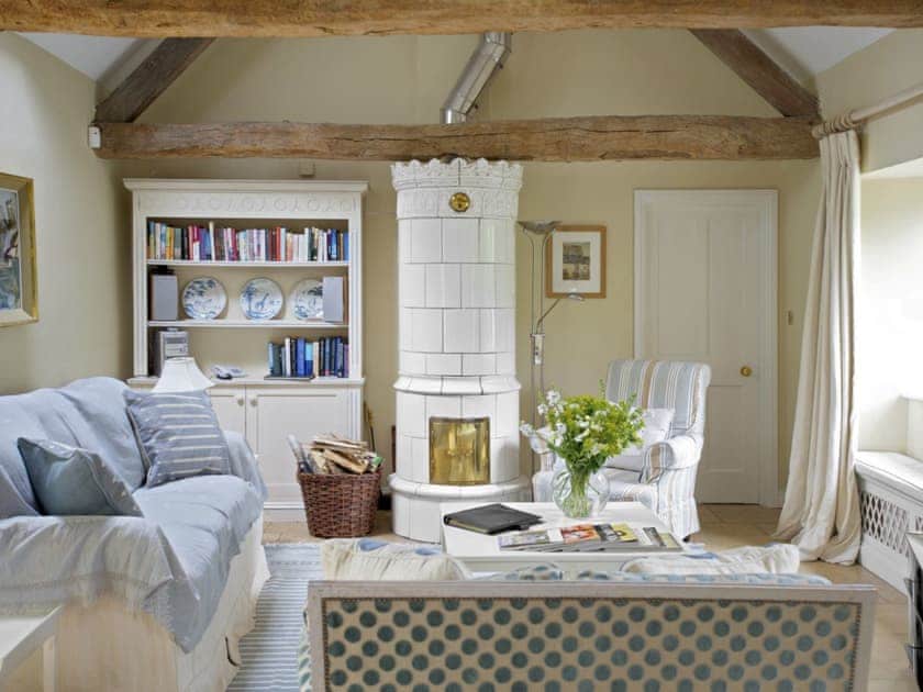 Spacious living room with quirky fireplace | Shipton - Bruern Holiday Cottages, Bruern, near Chipping Norton