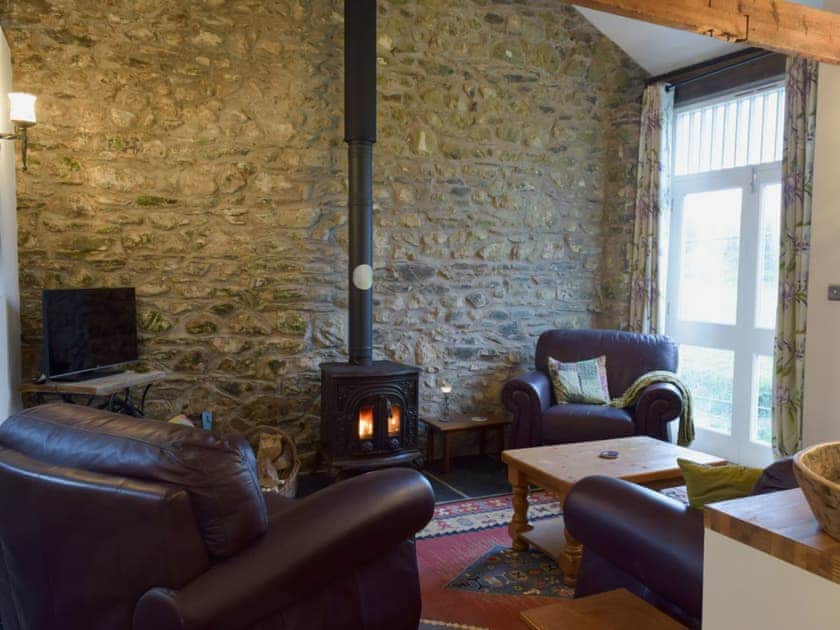 Cosy living area with wood burner | Ravens Roost - Upper Farm Barns, Mathry, near St Davids