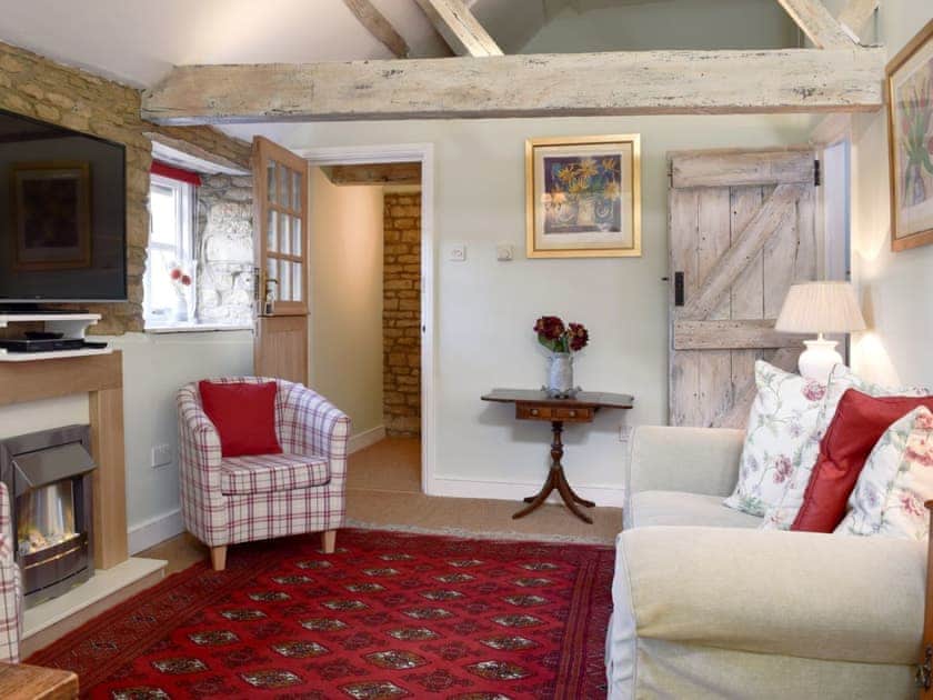Open plan living space with beamed ceiling | Coach Cottage - River Nene Cottages, Water Newton, near Peterborough