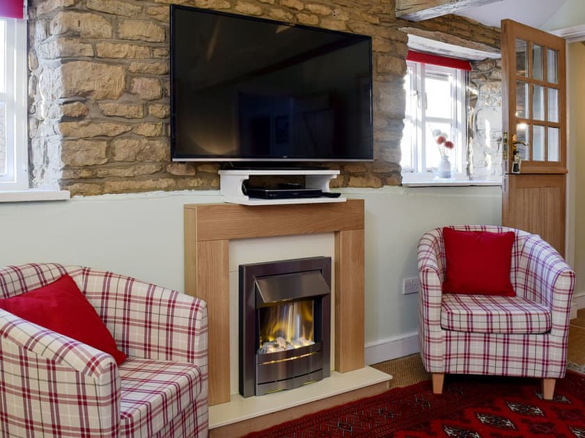 Cosy living area | Coach Cottage - River Nene Cottages, Water Newton, near Peterborough