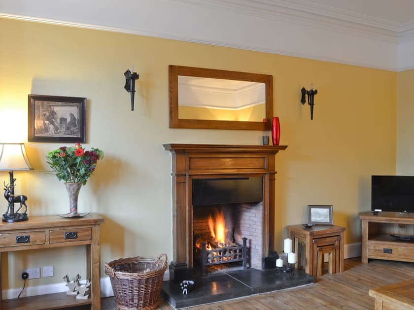 Living room with open fire | Dallas Brae, Grantown-on-Spey