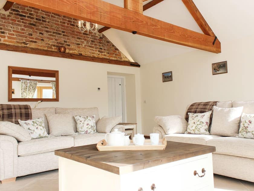 Beautifully presented living room with beams | The Old Barn - Corporation Farm Cottages, Tickton, near Beverley