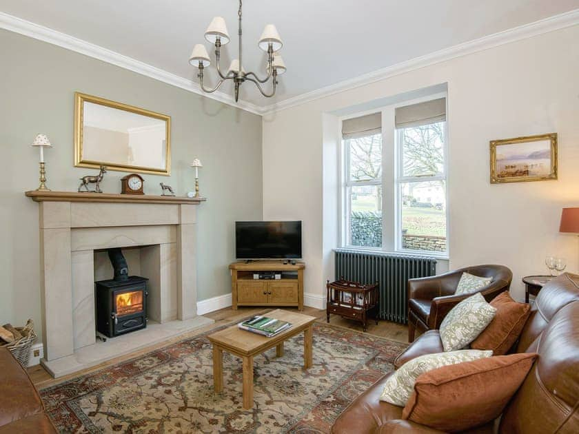 Cosy living room with wood burner | The Laburnums, Askham, near Penrith