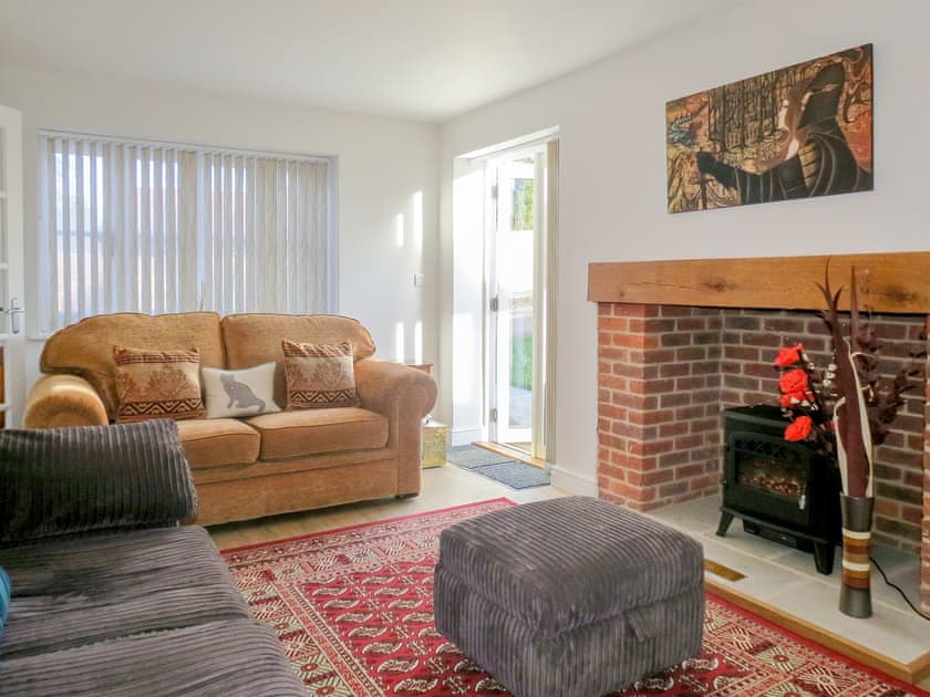 Living room with French doors leading to garden. | Roseanna Cottage, Middleton, near Leiston