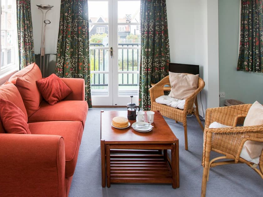 Living area with balcony access | 1 Bell Lodge, Thorpeness, near Aldeburgh