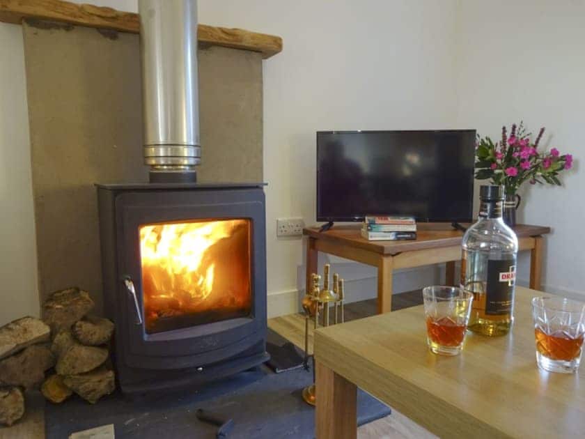 Warm and welcoming living room | Charlie’s Cottage, Muasdale, near Campbeltown