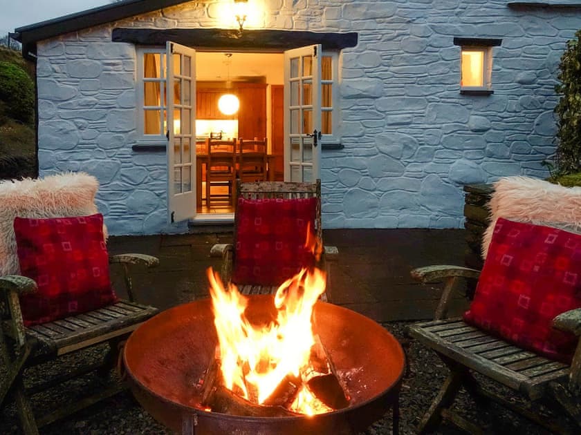 Enjoy an evening by the fire pit on the patio | Tyn Y Ffordd, Llanymawddwy near Dolgellau