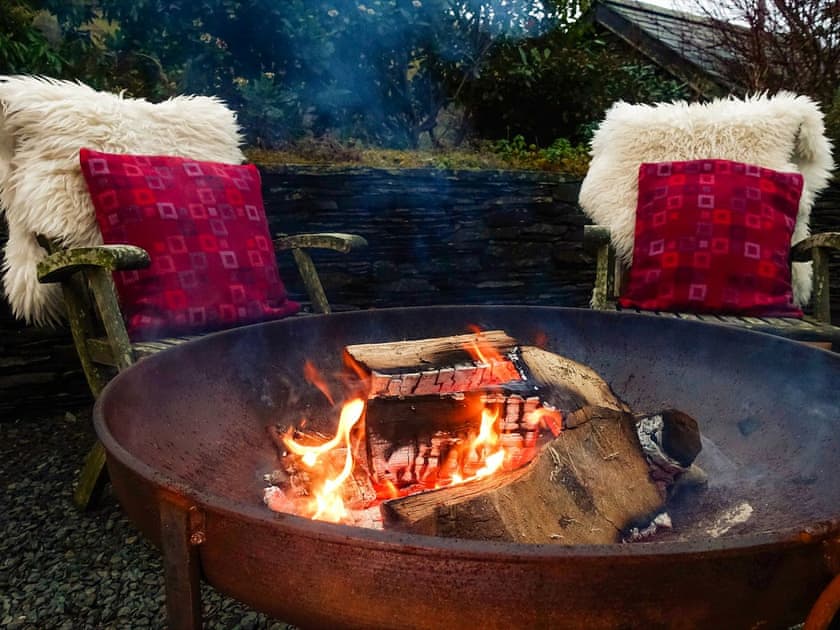 The cosy fire pit means pleasant evenings can be spent in the great outdoors | Tyn Y Ffordd, Llanymawddwy near Dolgellau