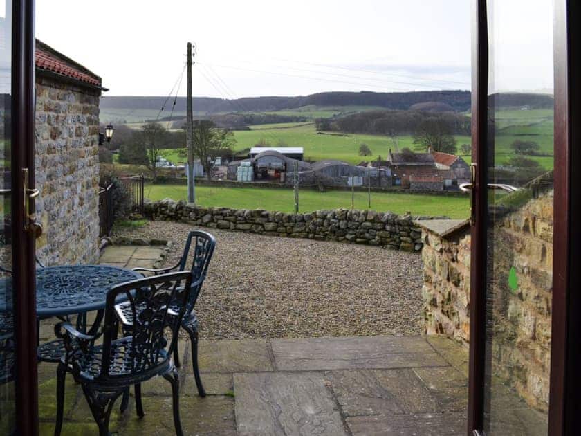 Patio with seating area and fine view | Ellis Close Farm - Swallows Nest - Ellis Close Farm Cottages, Harwood Dale, near Scarborough
