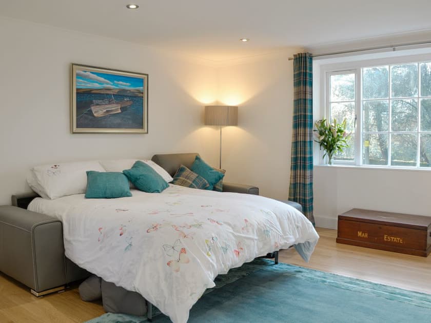 Second living room with sofa converted to a king-size sofa bed | Smithy House, Guthrie, near Forfar