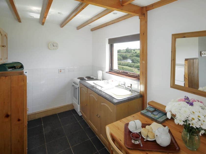 Convenient dining area and fully-equipped kitchen | Stable - East Rose, St Breward, near Bodmin