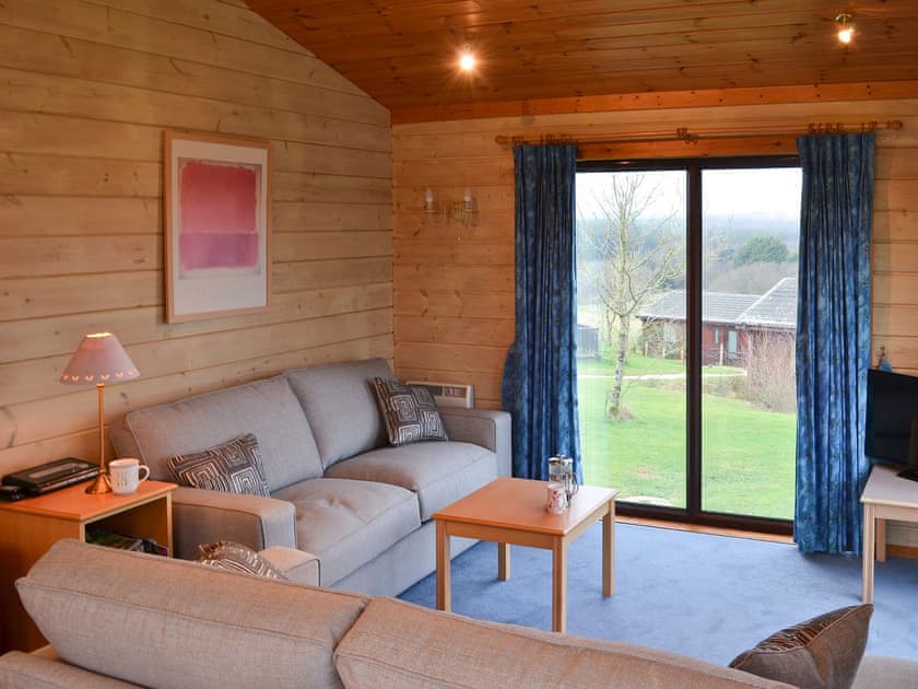 Dpacious, light and airy open plan living area | Lodge 59, Hartland Forest, near Bideford
