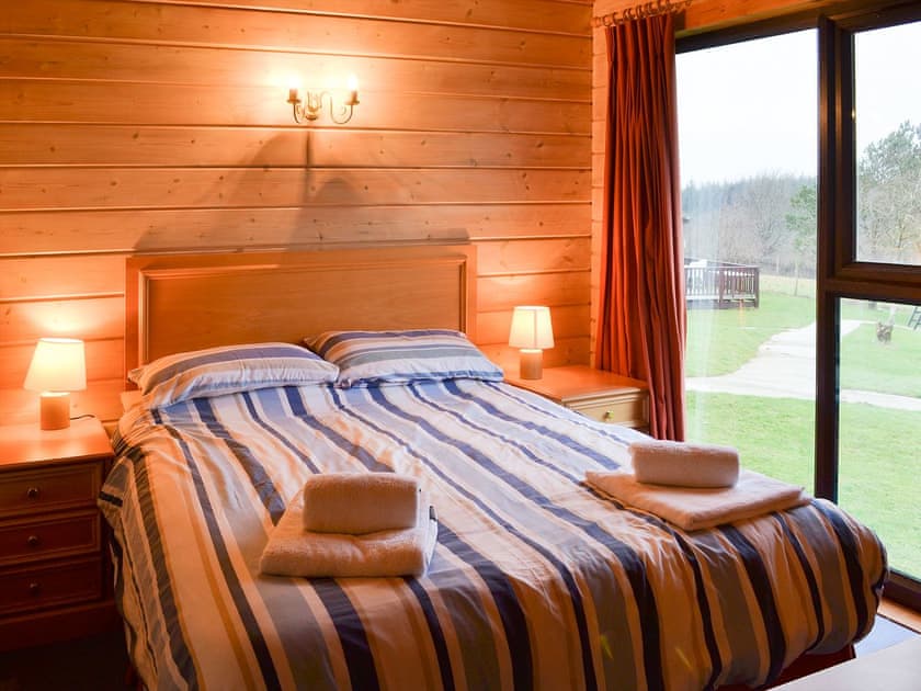 Cosy and romantic double bedroom with great views | Lodge 59, Hartland Forest, near Bideford