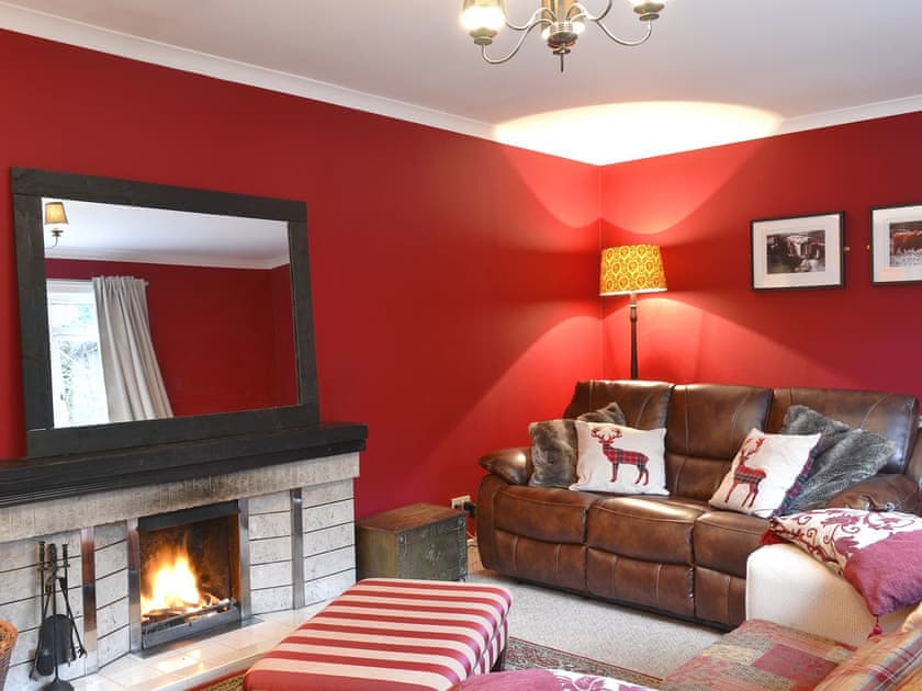 Cosy living room with an open fire | Torr Caladh, Glenfinnan, near Fort William