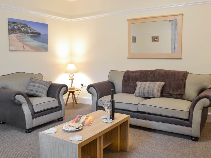 Comfy seating within living room | Montrose, New Quay