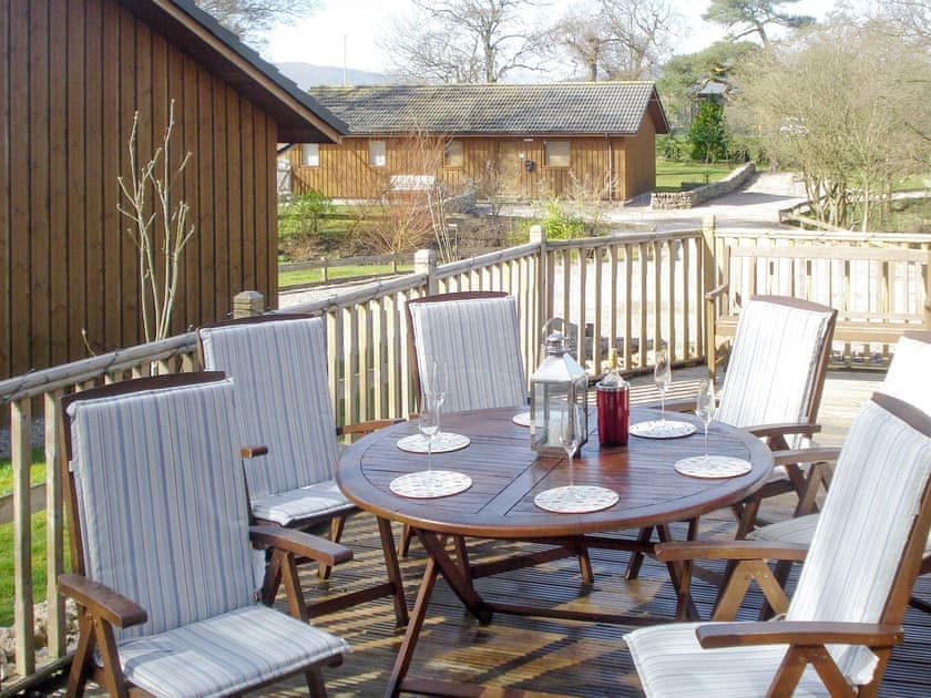 Raised decked area with outdoor furniture | Larchwood, Dukes Meadow, near Greystoke
