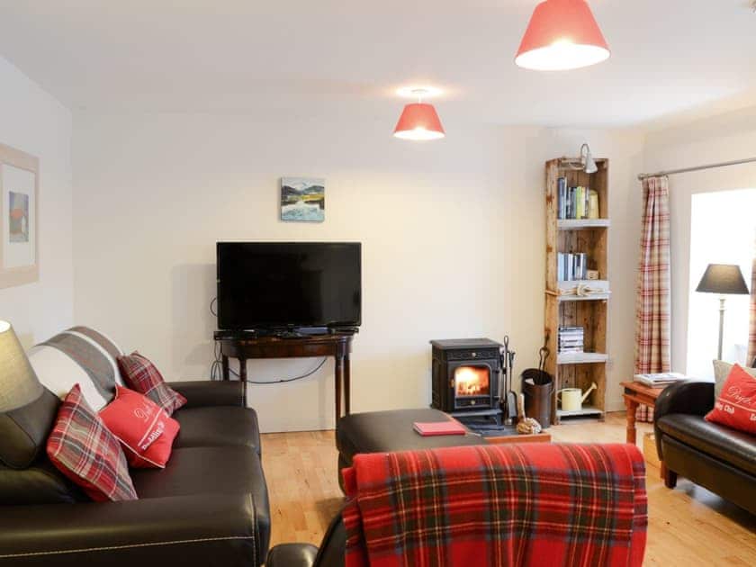 Spacious open plan living area with doublr sofa bed and wood burner | The Cottage, Rispond, near Durness