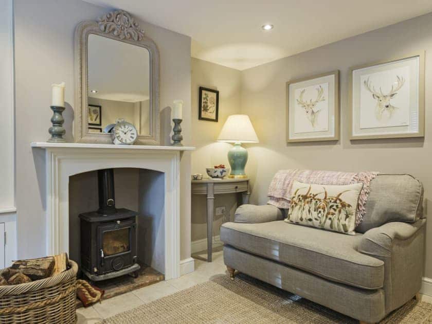 Stylishly furnished living room with wood burner | Pear Tree Cottage, Louth
