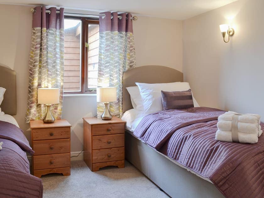 Comfortable twin bedroom | Pippins, Penybont