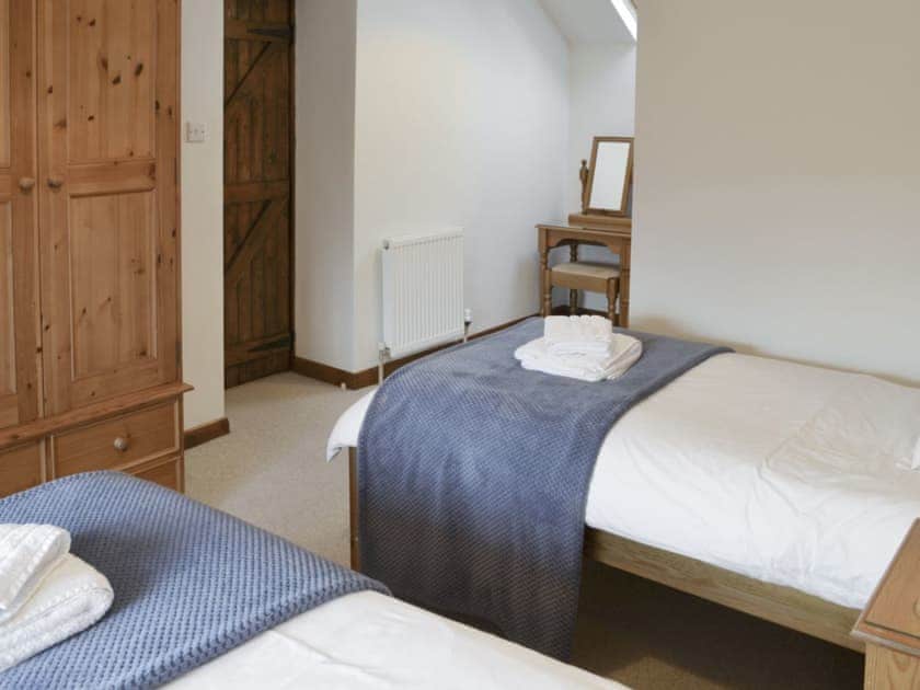 Ample storage and dressing area within twin bedroom | Daisy Cottage, Thornton-le-Dale