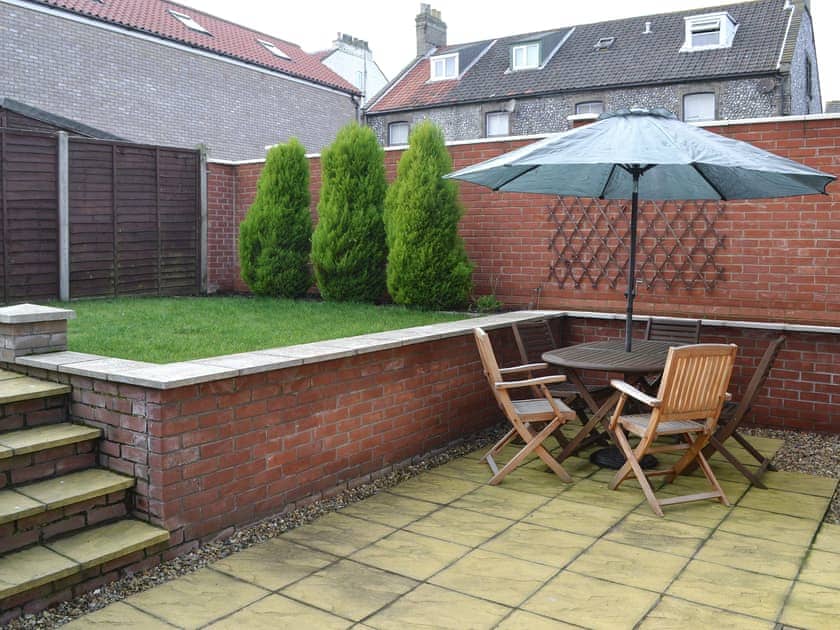 Sitting out area and garden | Old Dairy Court, Sheringham