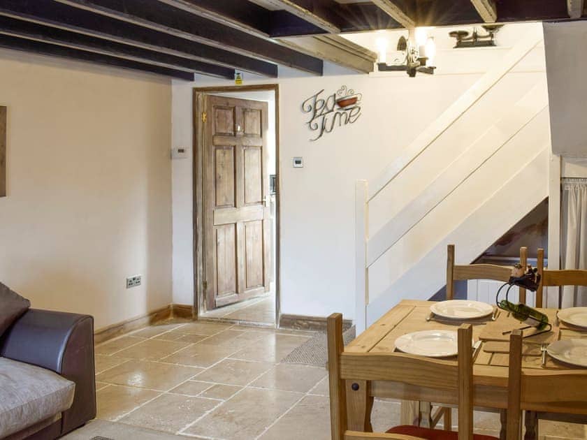 Spacious dining room with stair access to upper level | Listers Lodge, Brotton, near Saltburn-by-the-Sea