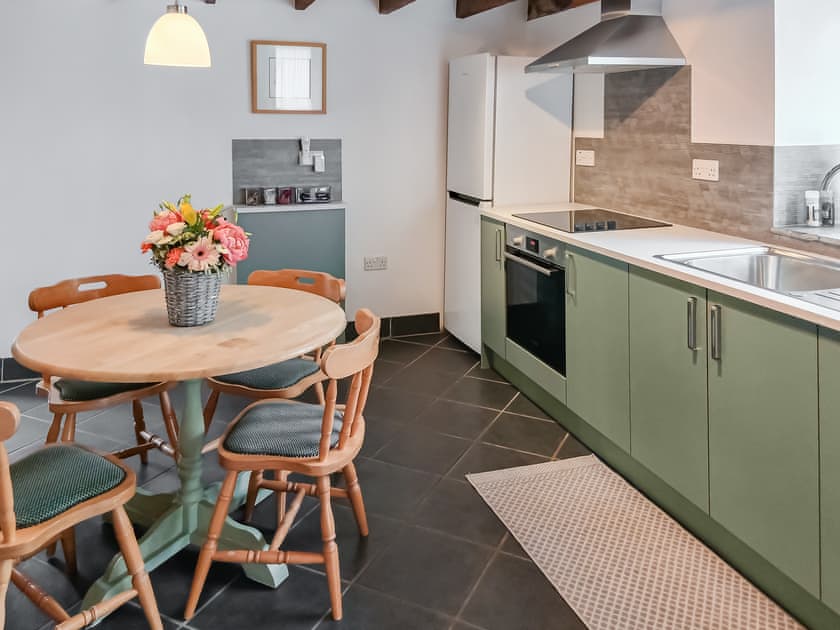 Kitchen/ dining room with beamed ceiling and slate floor | Beckaveans Granary - Beckaveans, Jacobstow, near Bude
