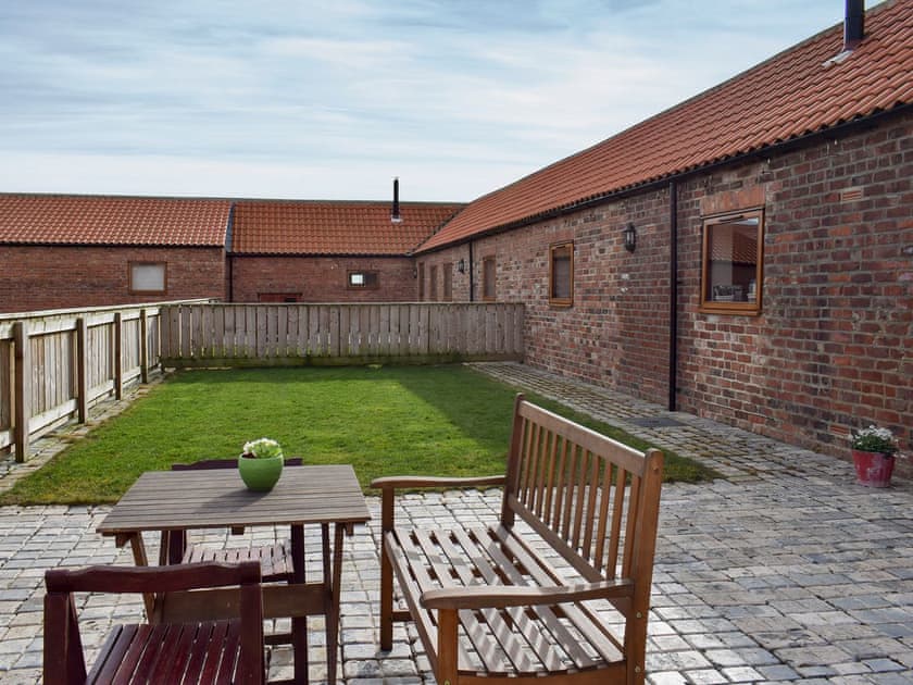 Enclosed garden with patio and garden furniture | Rupert’s Stable - Cleveland View Cottages, Easby Grange, near Great Ayton