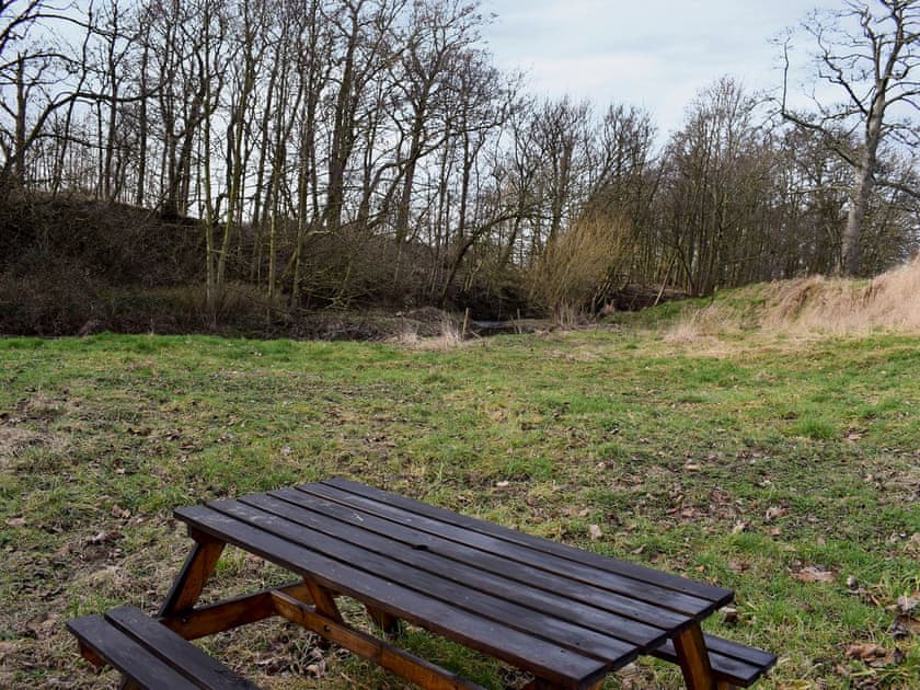 Shared picnic area by the river | Rupert’s Stable - Cleveland View Cottages, Easby Grange, near Great Ayton
