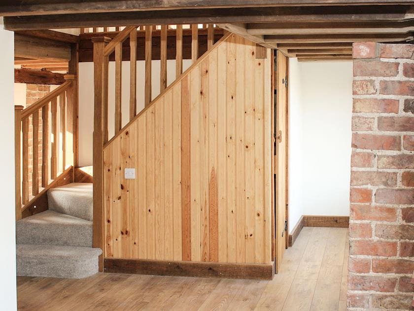 Hallway with flag floor and exposed brick and woodwork | The Cart Shed - Corporation Farm Cottages, Tickton, near Beverley