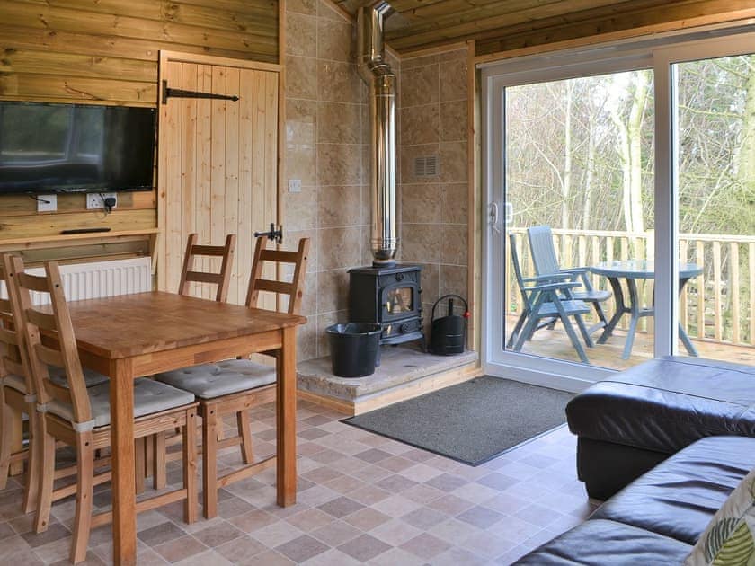 Convenient open-plan living area | Treehouse Cabin - Wallace Lane Farm Cottages, Brocklebank, near Caldbeck and Uldale
