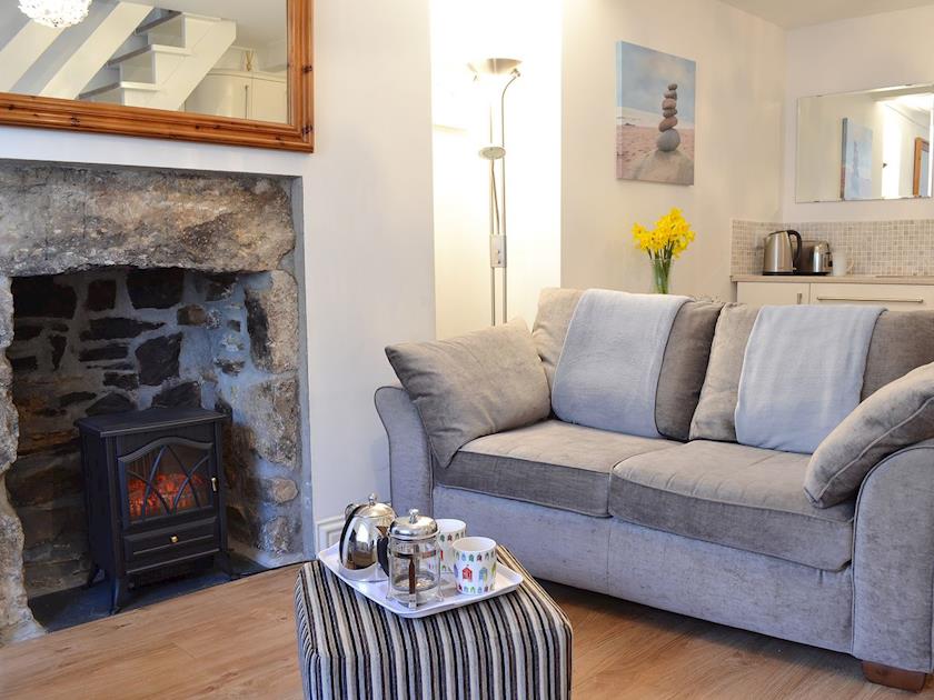 Open plan living area with electric woodburner | Harbour Lights, Newlyn, near Penzance