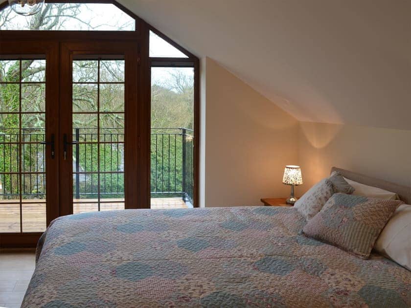 Double bedroom with balcony | Stabal Arthur - Trehwfa Cottages, Bodedern, near Holyhead