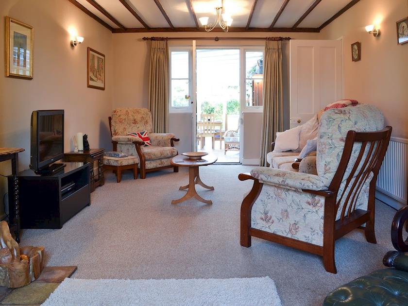 Charming beamed living room with access to conservatory | Pam’s Plaice, Offord D’Arcy, near Godmanchester