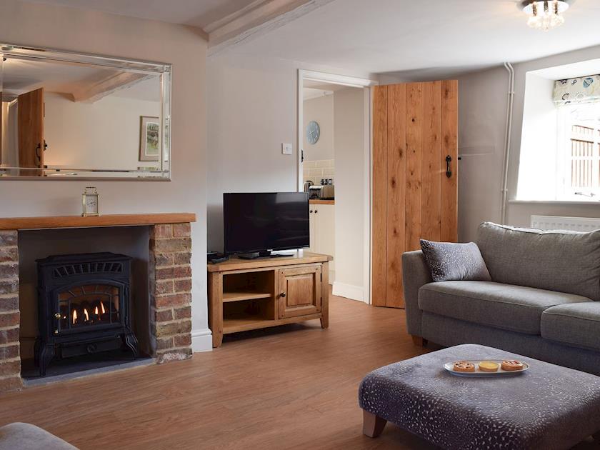 Living room with gas wood burner | Dick’s Cottage, Cottesmore, near Oakham