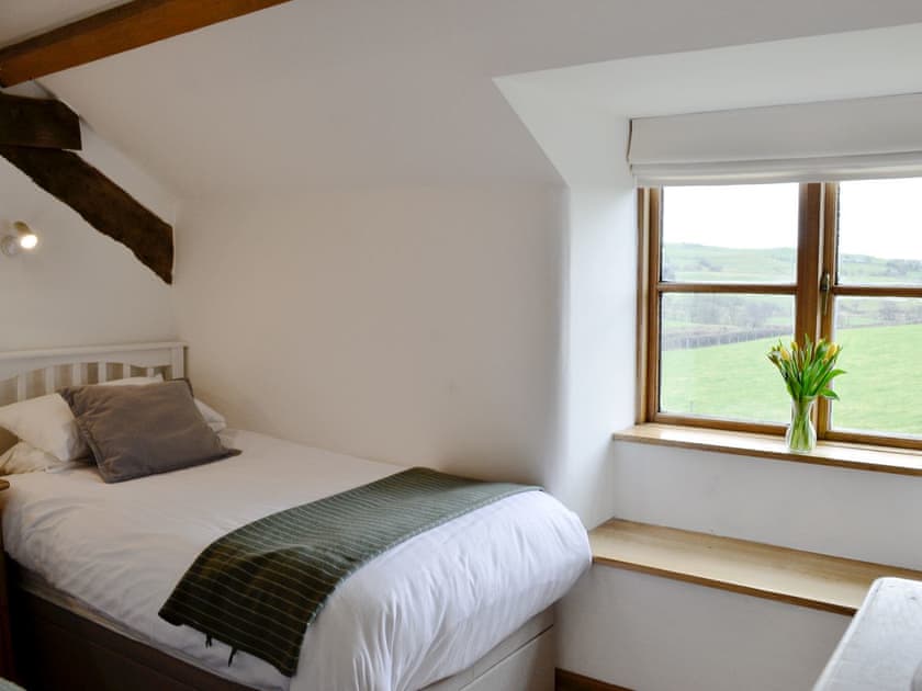 Twin bedroom with views out to the countryside | Bryn Gwnog, Llanrwst, near Betws-y-Coed