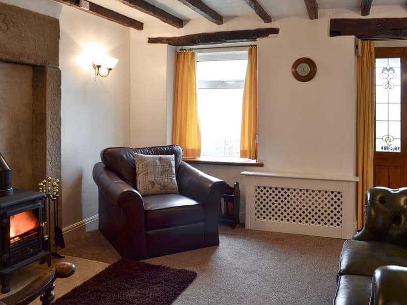 Cosy living room with wood burner | Wild Flower Cottage, Youlgreave, near Bakewell