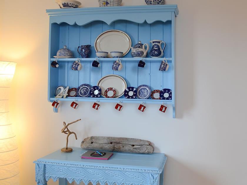Delightful shabby chic features adorn the walls | Fionn Croft Lodge, Melvaig, near Gairloch