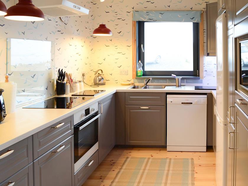 Stylish wood-floored kitchen area | Fionn Croft Lodge, Melvaig, near Gairloch