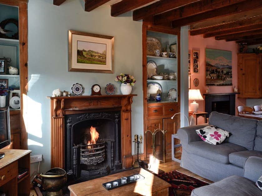 Cosy living room with open fire | Gwernol, Dolwyddelan, near Betws-y-Coed