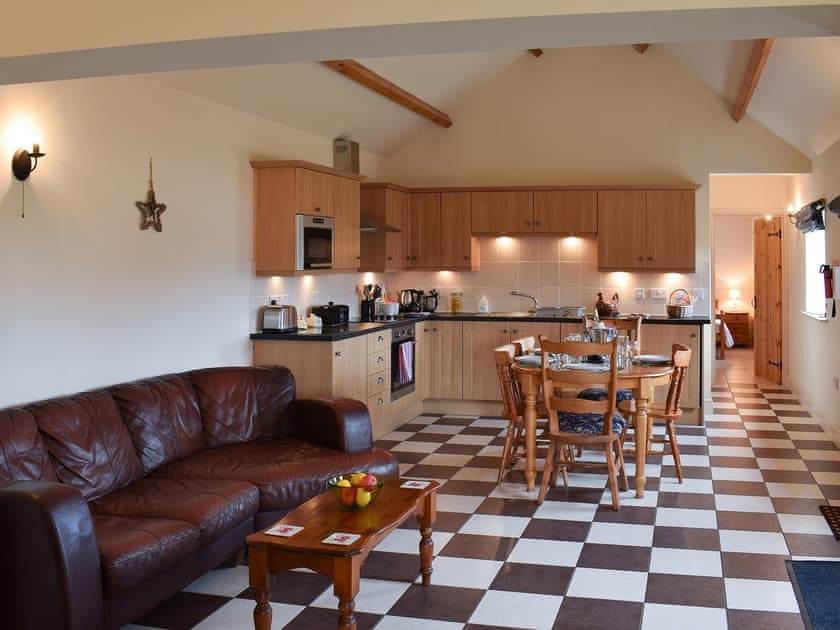 Tile-floored open plan living area | Betty’s Byre - Cleveland View Cottages, Easby Grange, near Great Ayton