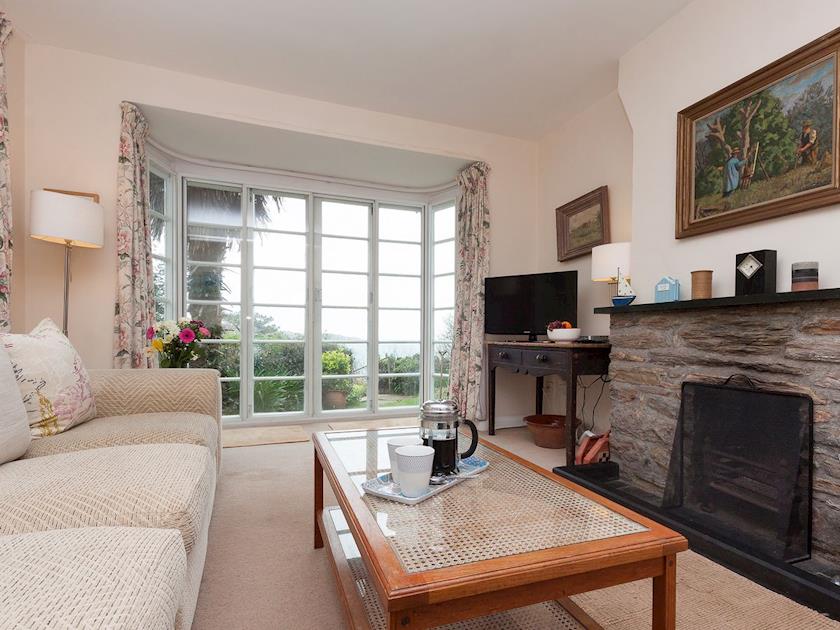 Sitting room with bay window and doors to garden | Anchorage, Salcombe