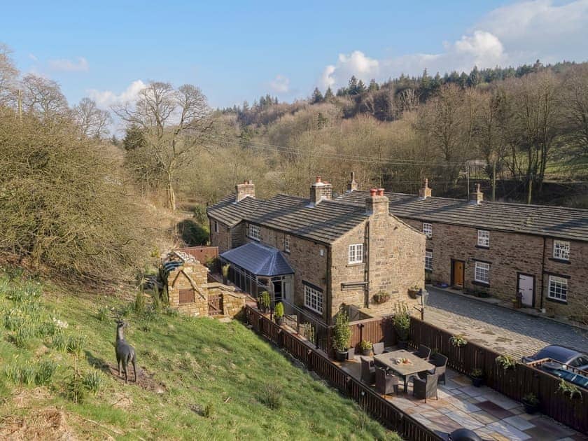 Looking down over the garden and patios to the lovely holiday home | Narrowgates Cottage, Barley, near Barrowford