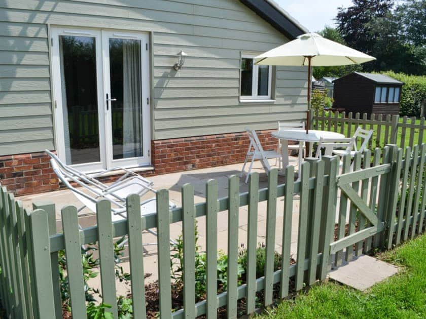 Enclosed patio with outdoor furniture | The Boat House, Roughton, near Cromer