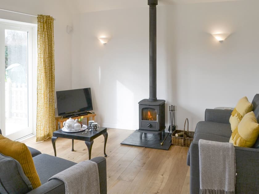 Spacious living area with wood-burner | The Boat House, Roughton, near Cromer