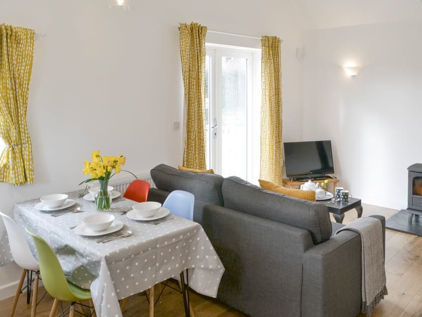 Convenient dining area within open-plan living space | The Boat House, Roughton, near Cromer