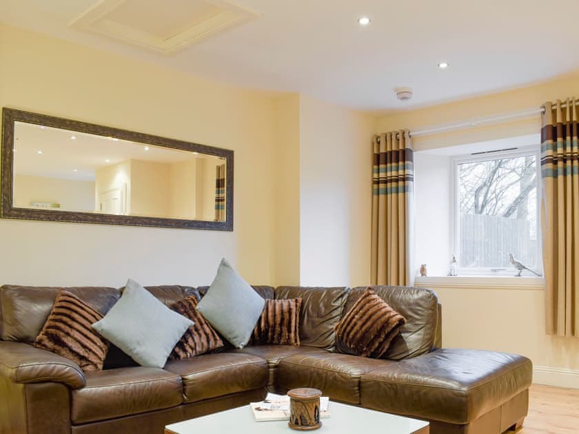 Comfy seating in living room | Kinneddar Cottage - Nether Kinneddar Lodge Cottages, Saline, near Dunfermline