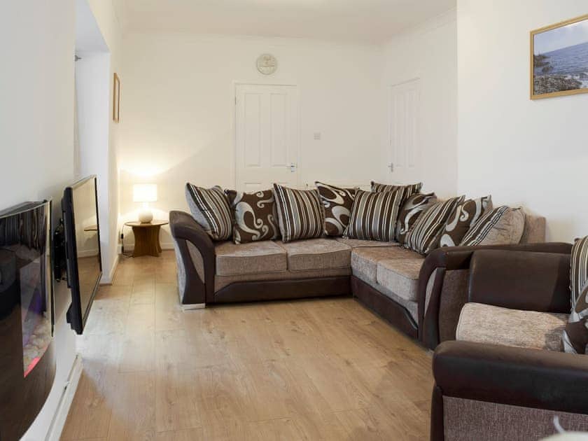 Comfy seating in spacious living area | Sea Breeze, The Mumbles